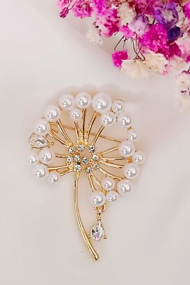 Broszka dmuchawca z perełkami