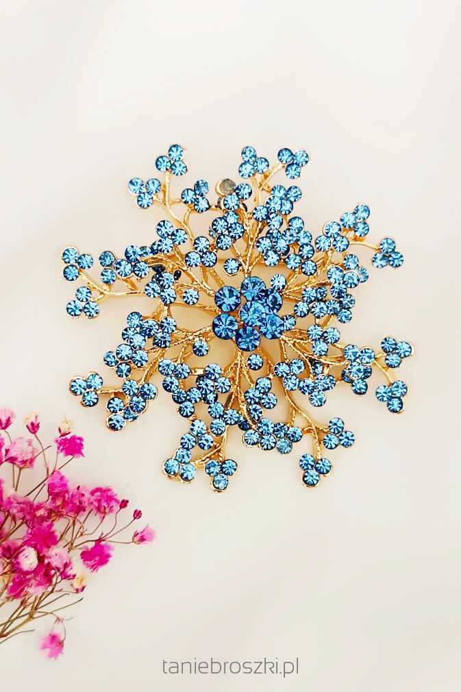 Duża przestrzenna broszka z niebieskimi cyrkoniami